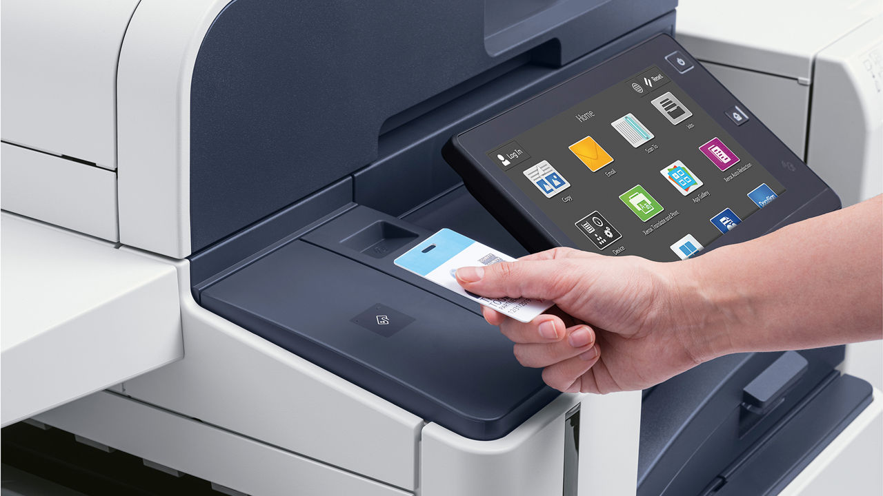 Hand holding an ID card up to an Xerox AltaLink 8100 series RFID