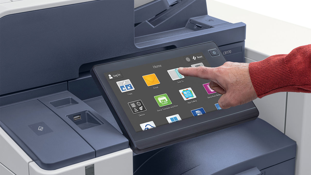 Hand holding pressing UI screen to an Xerox AltaLink 8100 series