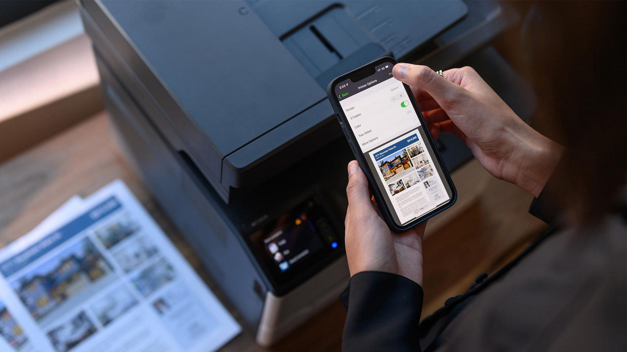 A person printing using Lexmark small business printer using mobile print