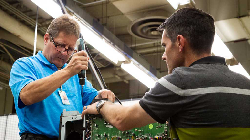 man using tool on lexmark device