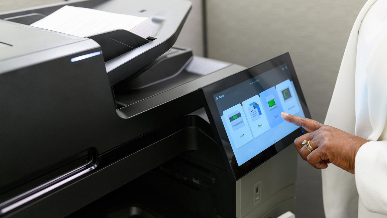 person using Lexmark GUI panel to scan documents